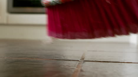 view of a mop swiping the floor