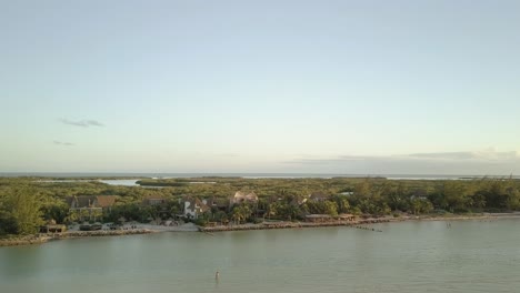 AERIAL---Beautiful-beaches-of-the-Yucatan-Peninsula,-Holbox-Island,-Mexico,-lowering