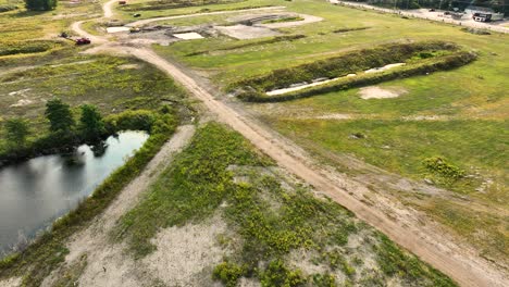 Construction-machinery-leveling-and-filling-areas-before-construction