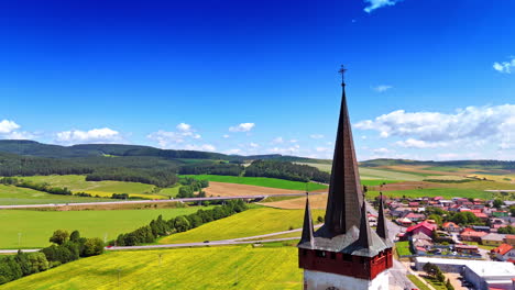 footage at the steeple of the old church. aerial perspective on the picturesque countryside in slovakia