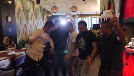 a group of middle east man dancing their tradisional folk dance with joy