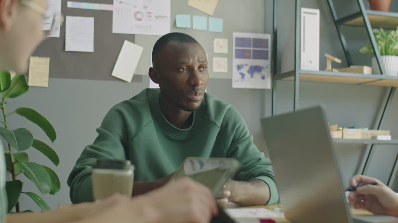 African American Team Leader Holding Office Meeting