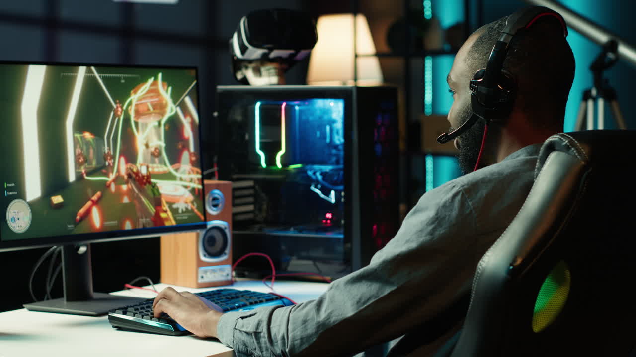 Dejected man hitting desk after seeing game over message on computer screen