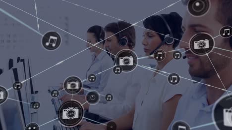 Animation-of-network-of-connection-with-icons-over-business-people-wearing-phone-headsets