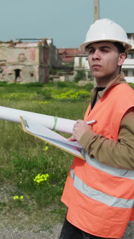 building engineer writing notes while working outdoor