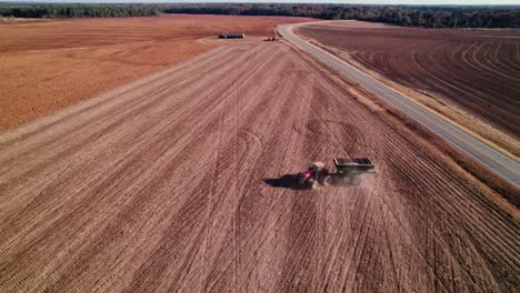 tractor with non gmo soybeans makes a turn on a farm in georgia, usa