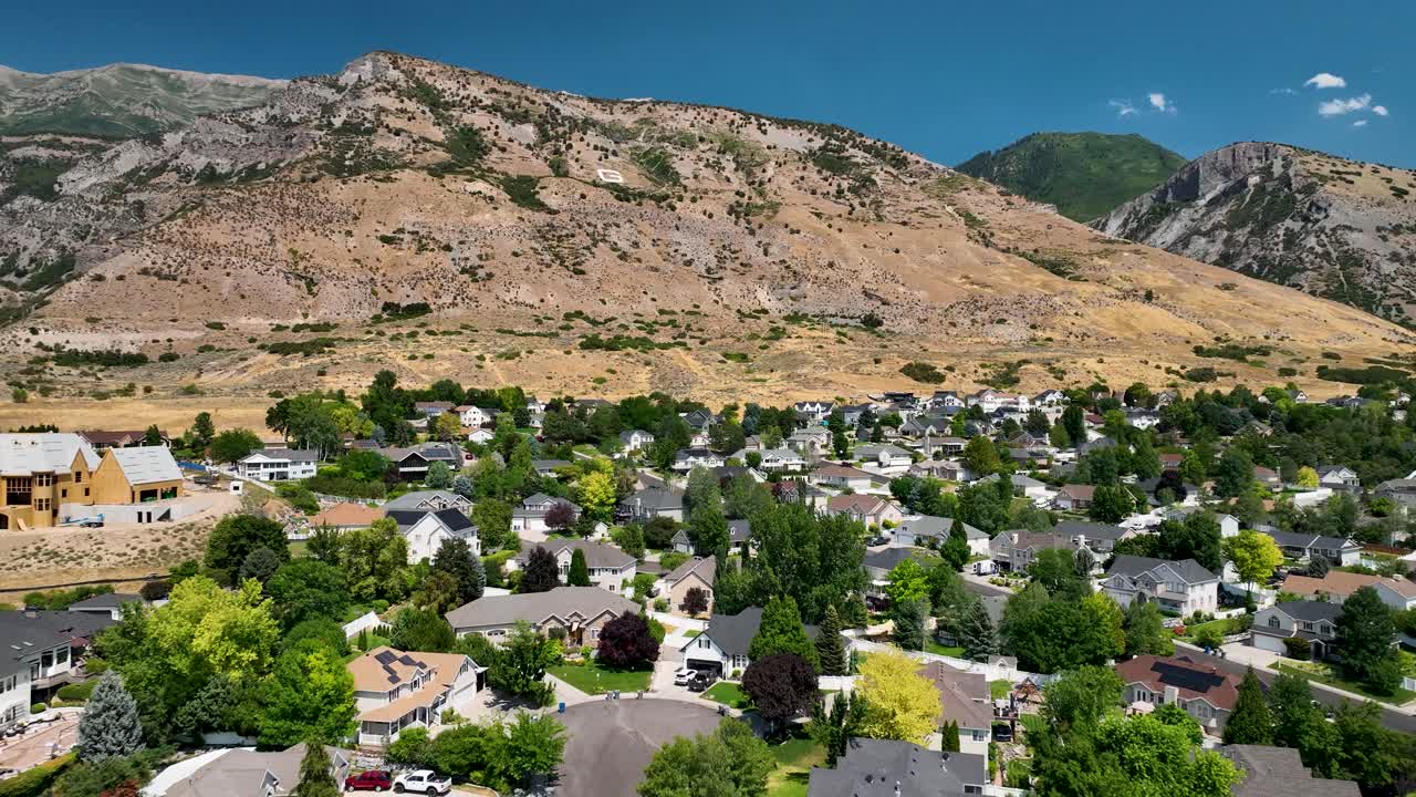 Custom Home Under Construction In A Suburban Neighborhood Of Pleasant Grove In Utah. Aerial Pull Back Shot
