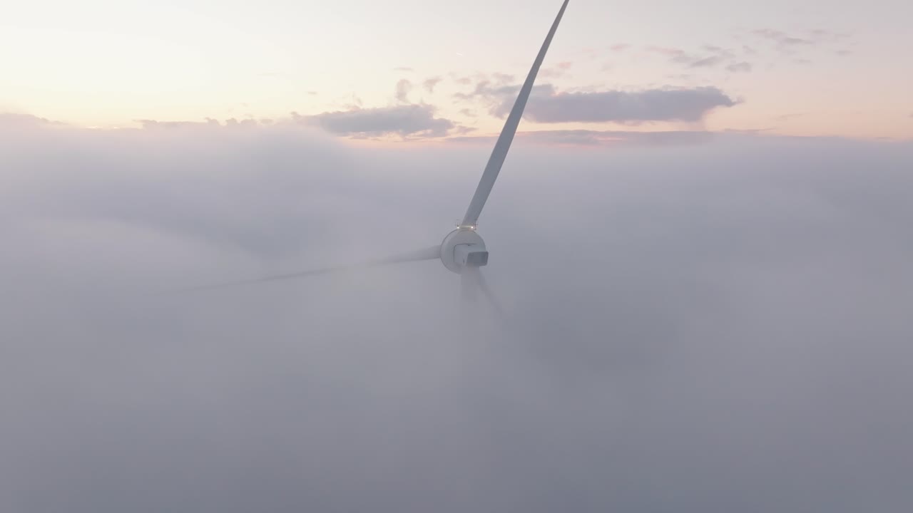 Drone shot of a Windturbine in foggy conditions