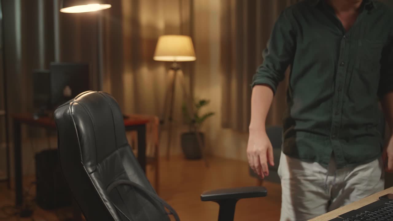 Asian Male Start Works On His Personal Computer With Big Display, He Works At Night