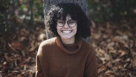 Nervous-smile-reading-favorite-novel-curly-girl-in-slow-motion