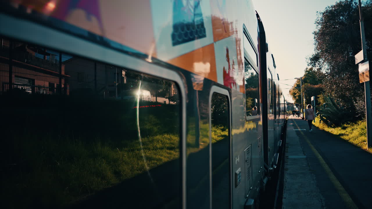 Close up of a colourful train moving on the rails near a station in France