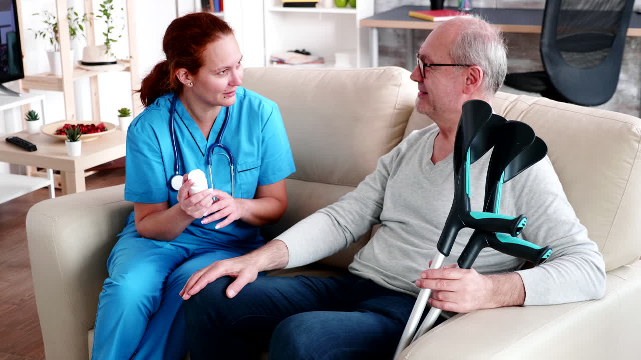 Old man in nursing home holding crutches