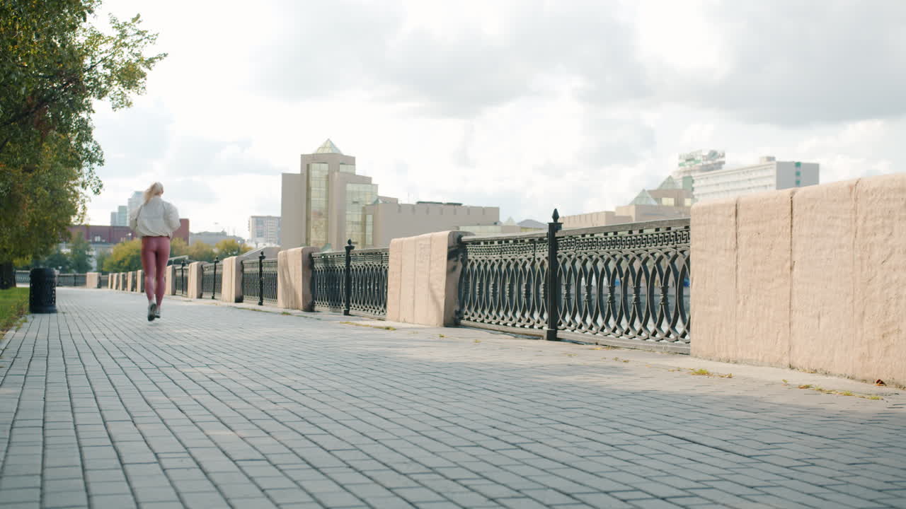 Woman Jogging on City Path