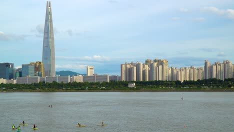 lotte world tower skyscraper over han river at sunset