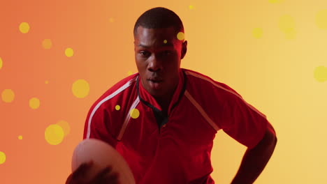 animation of lens flares, african american player running holding rugby ball on gradient background