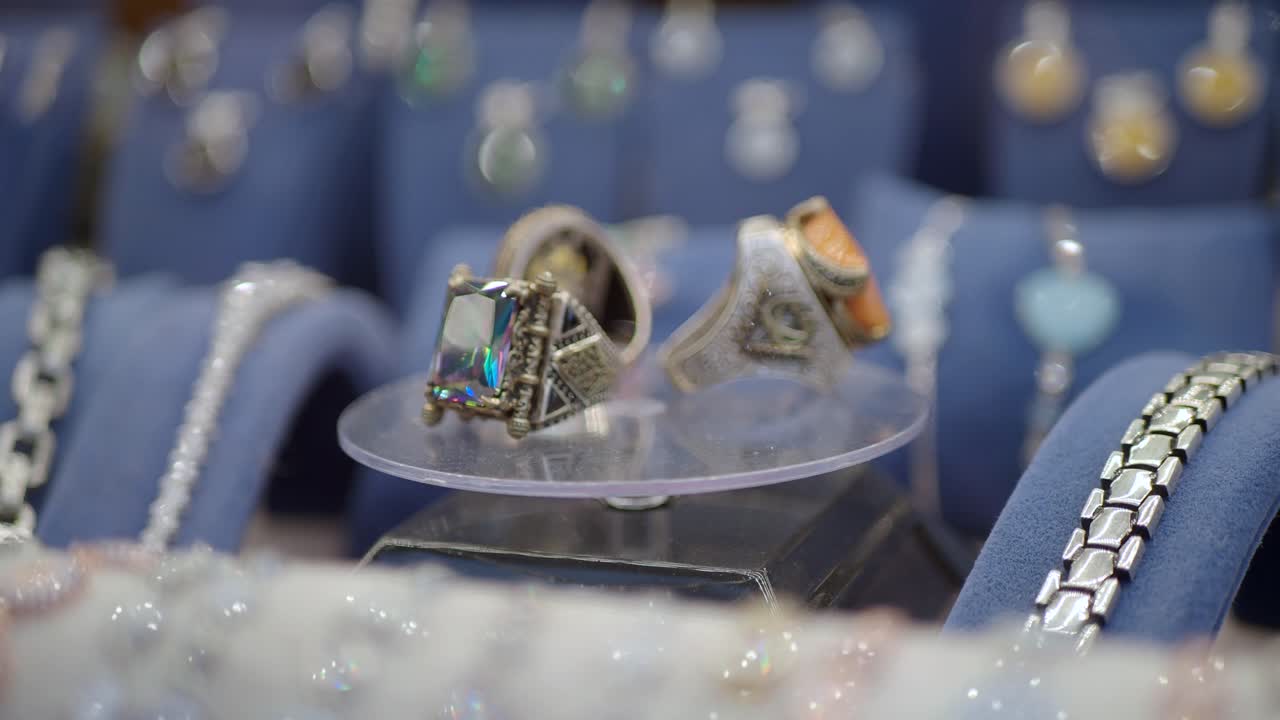 Close-up of Silver and Gold Rings with Gemstones