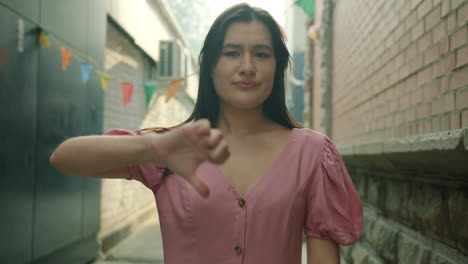 disapproving woman in alley