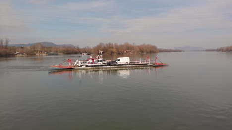 Ferry-carrying-cars-and-people-on-a-river