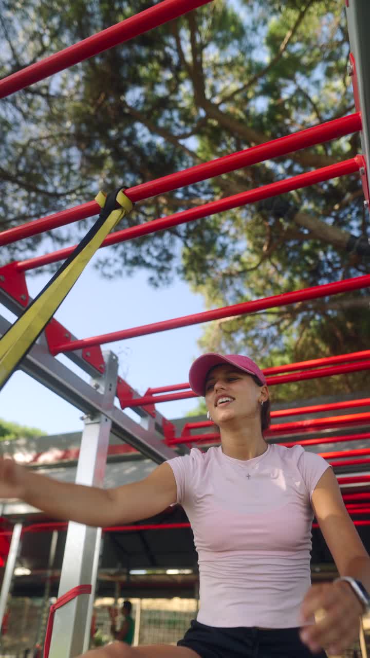 Woman performing pull-ups outdoors