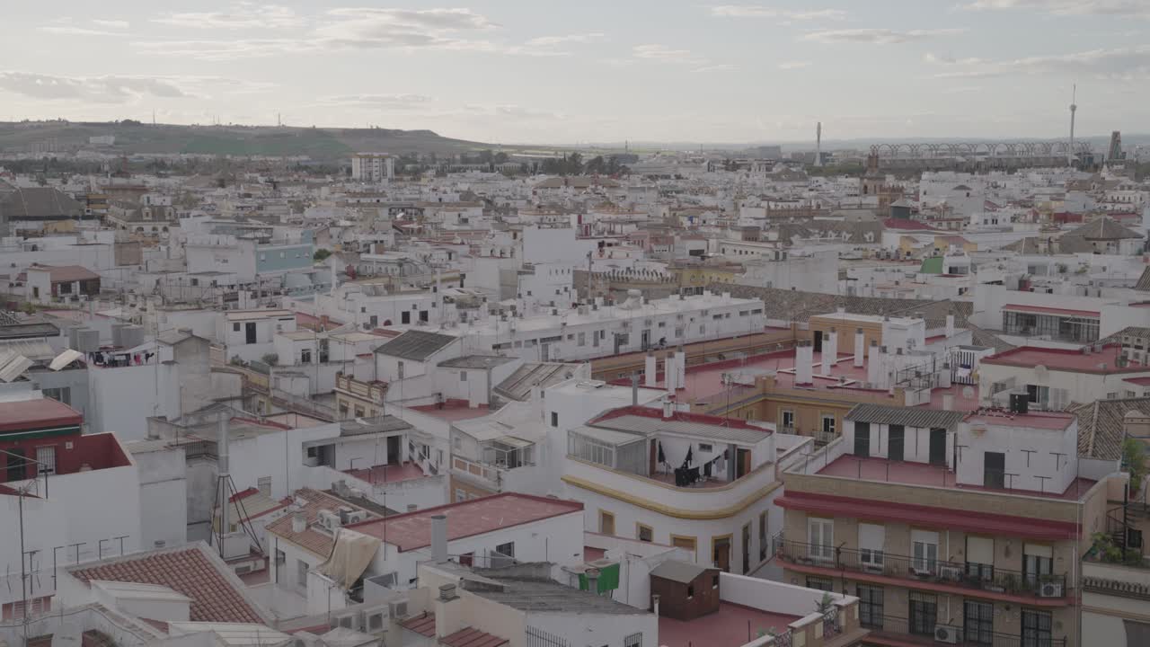 Aerial view of a city with white buildings and red rooftops