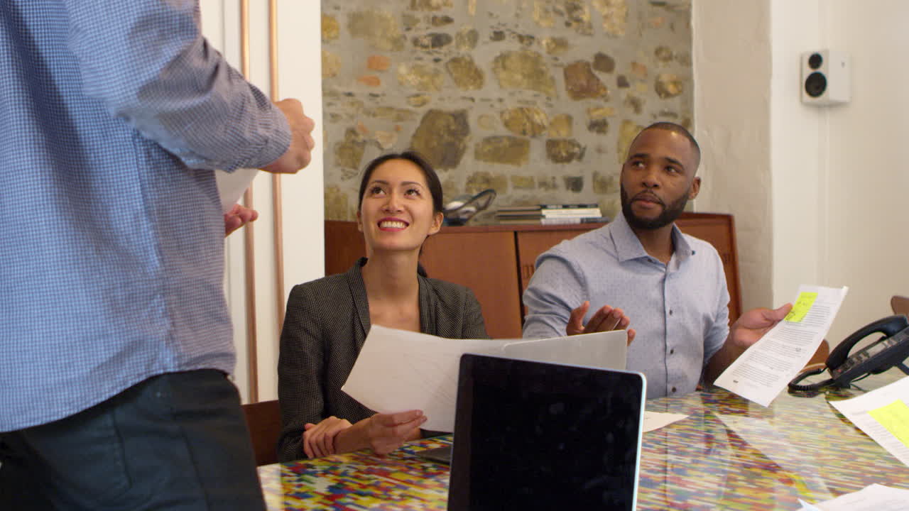 Team meeting in a boardroom, low angle, close up