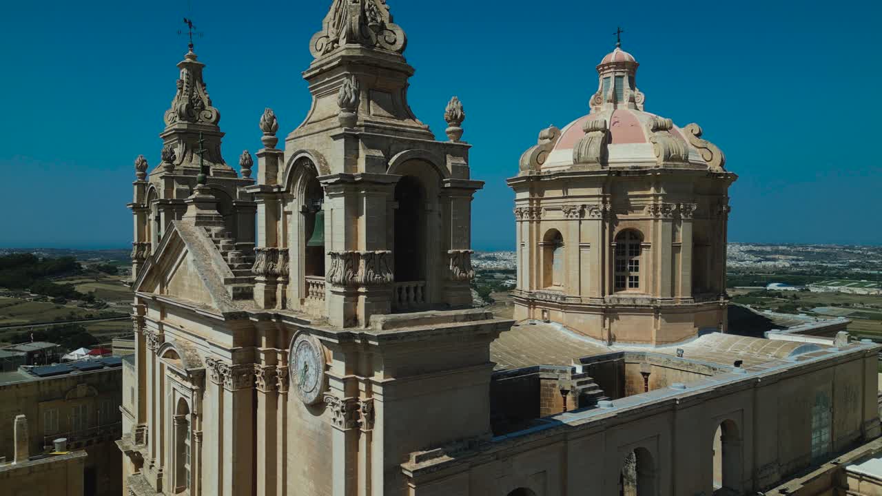 Exterior of St. Paul's Cathedral, Mdina, Malta, close-up ascending aerial view
