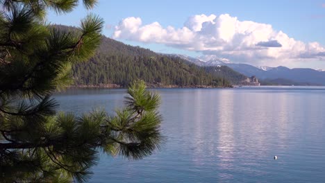 Pretty-establishing-shot-of-the-shores-of-Lake-Tahoe-Nevada-with-Sierras-and-Cave-Rock-Nevada