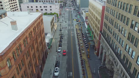 looking straight down broadway main high street, los angeles, california, drone shot reveal