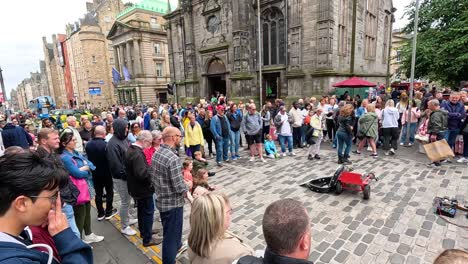 crowd enjoying a street musician's performance