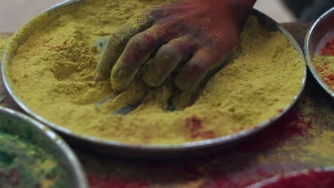 indian women close-up of face smeared with bright holi colors