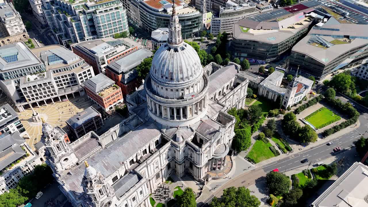 Breathtaking aerial view of St. Paul’s Cathedral in London, showcasing its iconic dome, historic architecture, and bustling cityscape under vibrant skies. Perfect for travel and history content