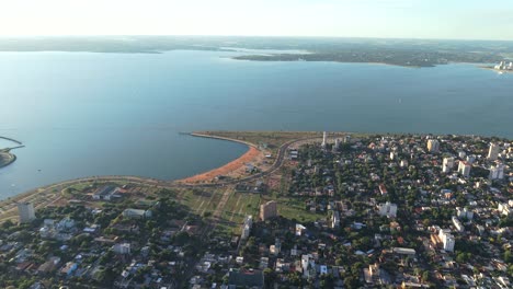 aerial view of the posadas city with expansive el brete bay and visible shoreline, misiones, argentina.
