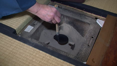 ashes are removed from a japanese shichirin charcoal stove