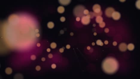 Animation-of-pink-spots-moving-on-black-background