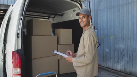 portrait of a male van driver with a warehouse delivery