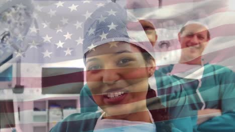 animation of flag of usa waving over surgeons in operating theatre