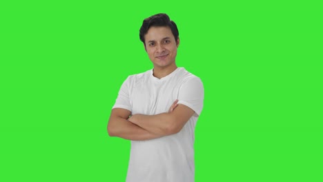 Portrait-of-Happy-Indian-man-standing-crossed-hands-Green-screen