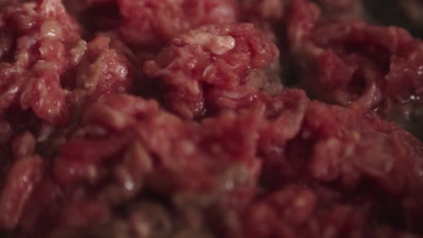 close-up of the texture of ground beef cooking in a pan