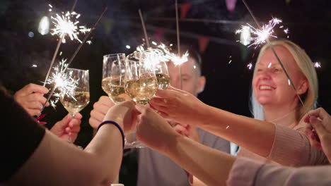 friends celebrating with sparkler toasts