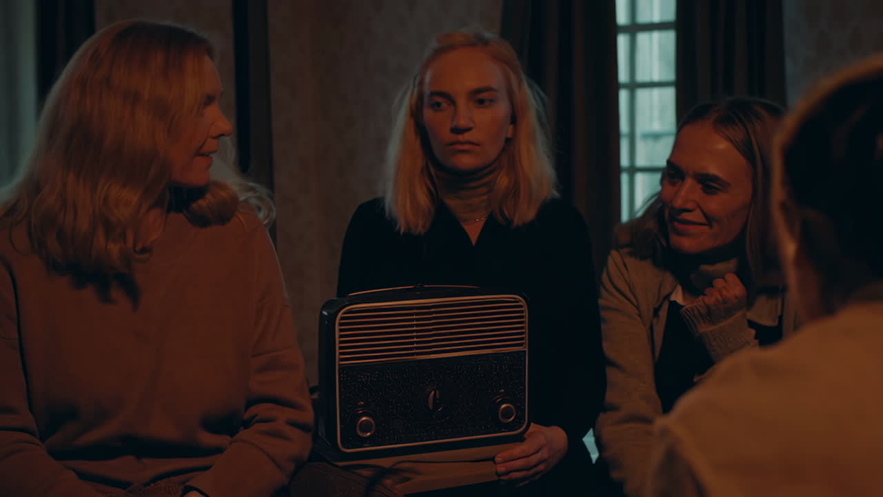Group Gathering Around a Vintage Radio in a Dimly Lit Room