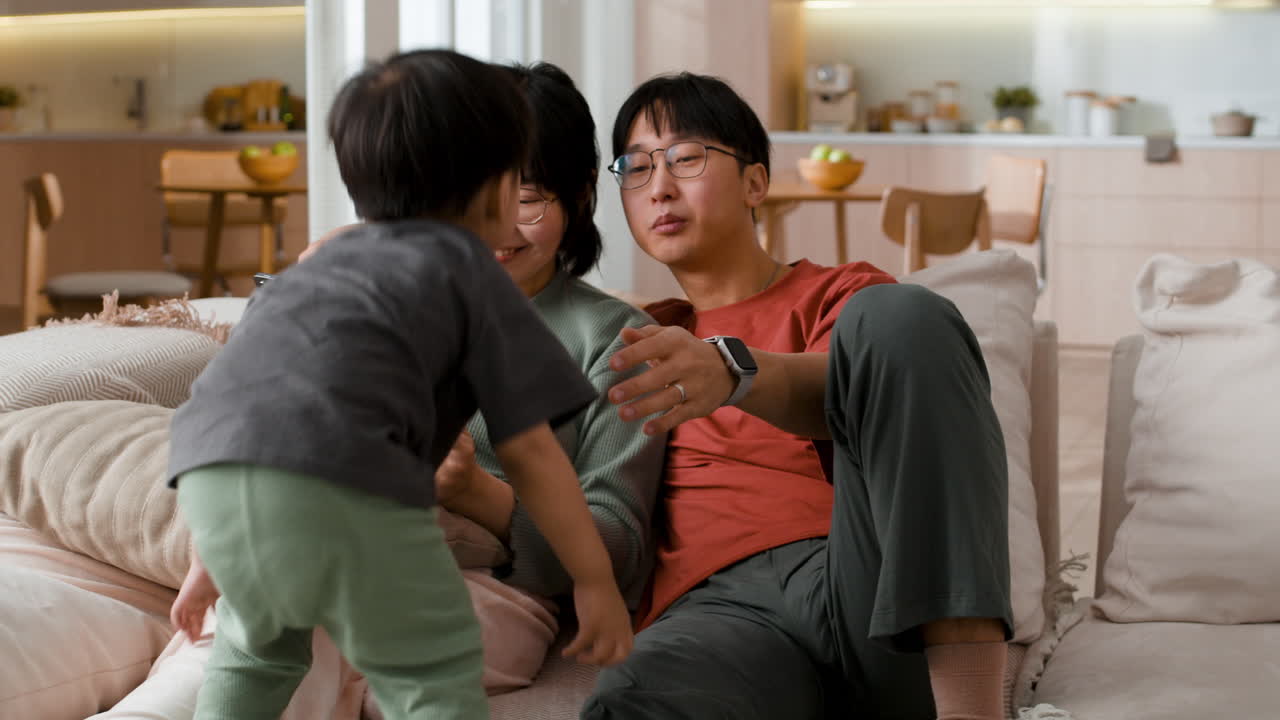 Family enjoying time together at home with a tablet