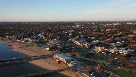 aerial video flying away from the beach of brighton in melbourne, australia