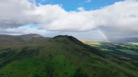 Aerial-Angle-Lifting-up-to-Reveal-Conic-Hill-Located-Next-to-Loch-Lomond,-Scotland