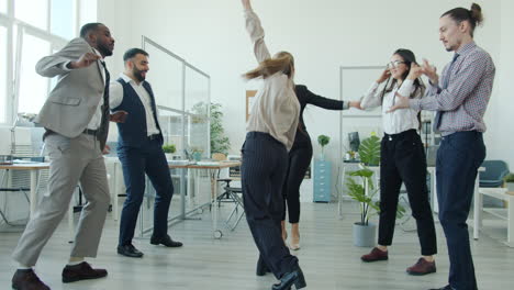 happy office staff dancing