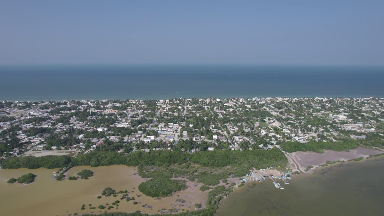 drone view of the fishing town of progreso in yucatan with its mangrove