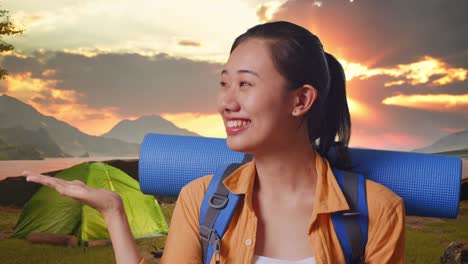 smiling woman on camping trip at sunrise