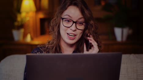 Portrait-Of-Businesswoman-Working-On-Laptop-While-Talking-On-Mobile-Phone-6