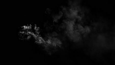 isolated puff of white fog or smoke appears and drifts gently before dissipating on a black background. perfect for subtle vfx accents or atmospheric detail