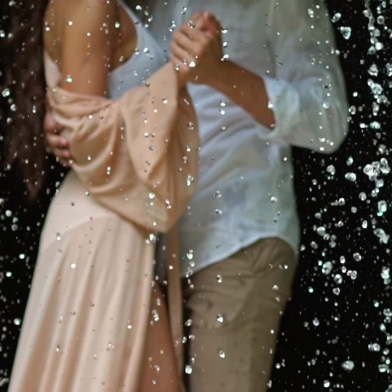 Couple of lovers under rain
