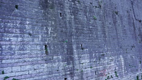 Stone-wall-texture-of-medieval-building-in-Albania,-copy-space-for-historic-place